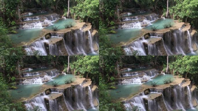 大自然美丽的夏季怀美哈明瀑布，瀑布落在绿色的雨林中，是泰国北碧府热带丛林中的大型天然水资源。