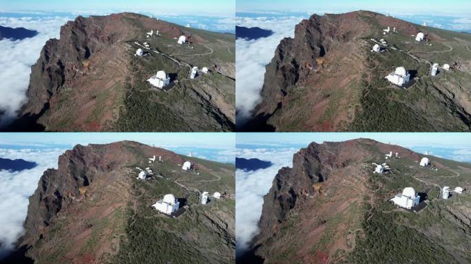 巨大的太空望远镜坐落在山顶的云层之上