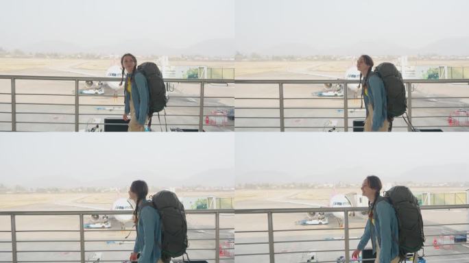 一名女子在机场行走，背景是飞机