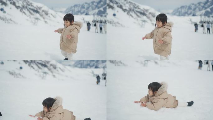 可爱的小女孩走在雪地上，跌倒，然后站起来。
