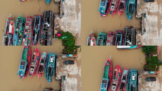 渔村与传统船污染的水在埃及港口。在埃及的港口，空船等待着一天捕鱼的开始。在埃及受污染的港口享受乘船钓