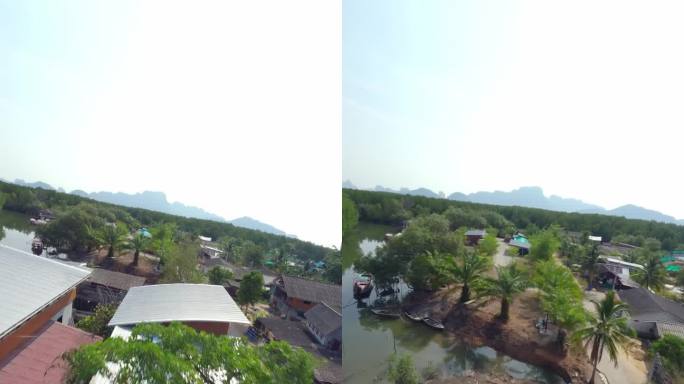 垂直视频。飞屋屋顶亚洲村河水路运输自行车路