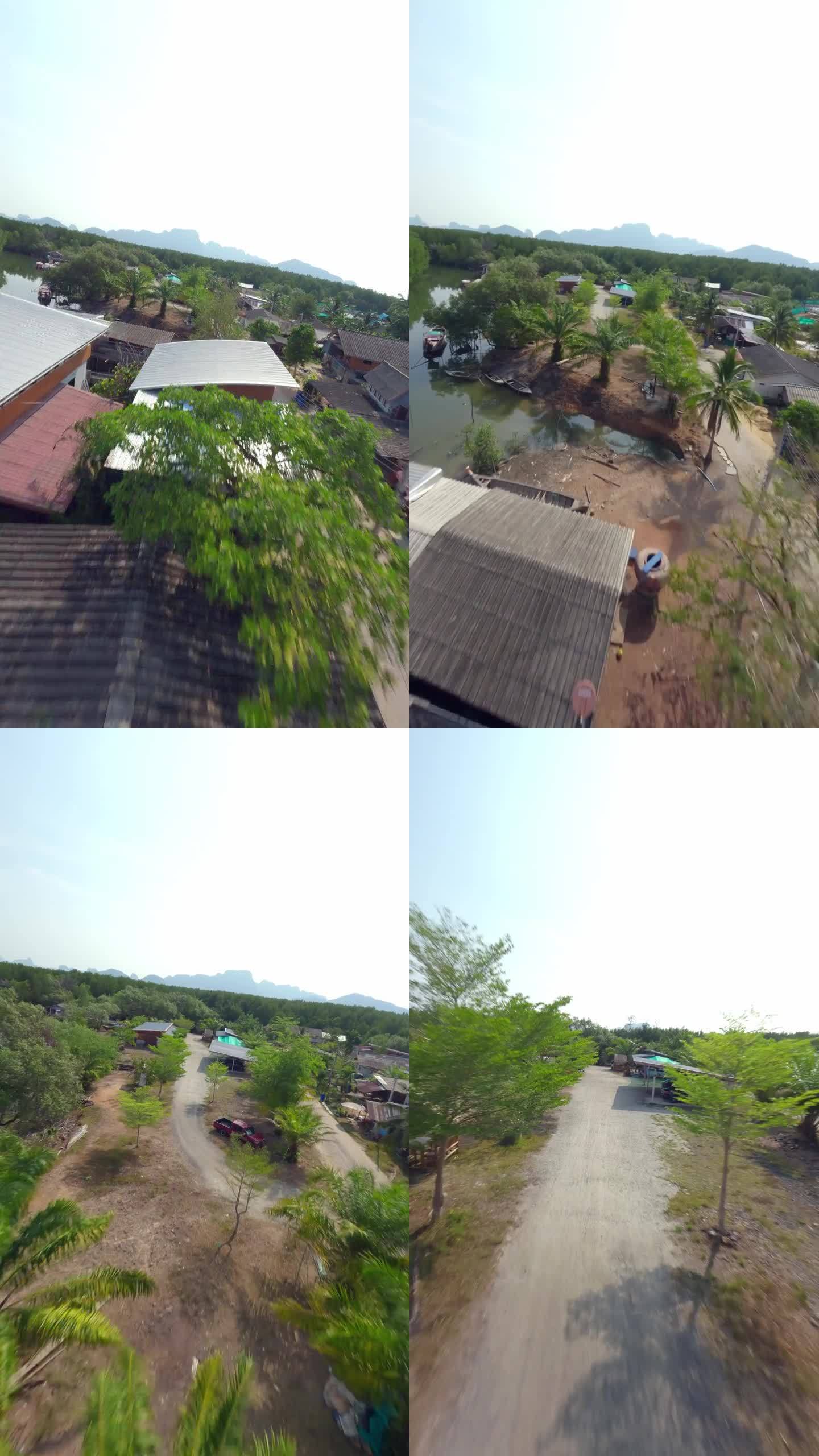 垂直视频。飞屋屋顶亚洲村河水路运输自行车路