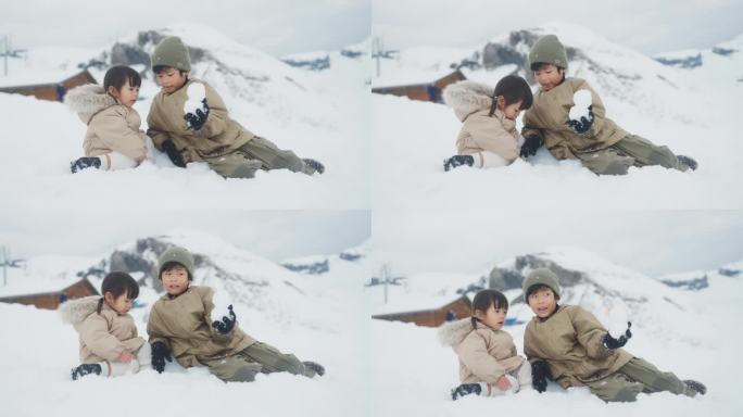 兄弟姐妹坐在雪山上聊天，哥哥给妹妹堆了一个可爱的雪人。