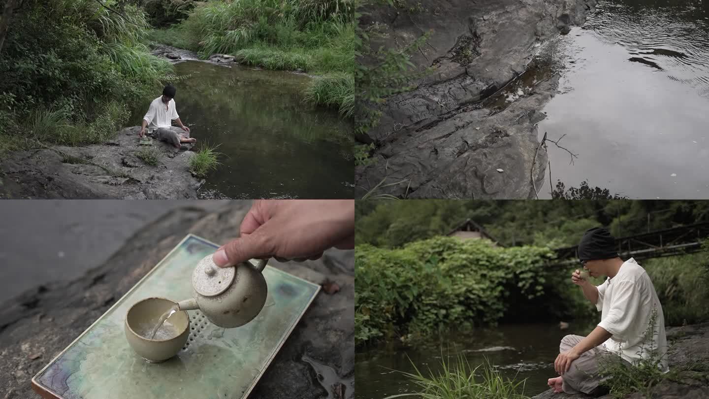 男子河边唯美喝茶思考