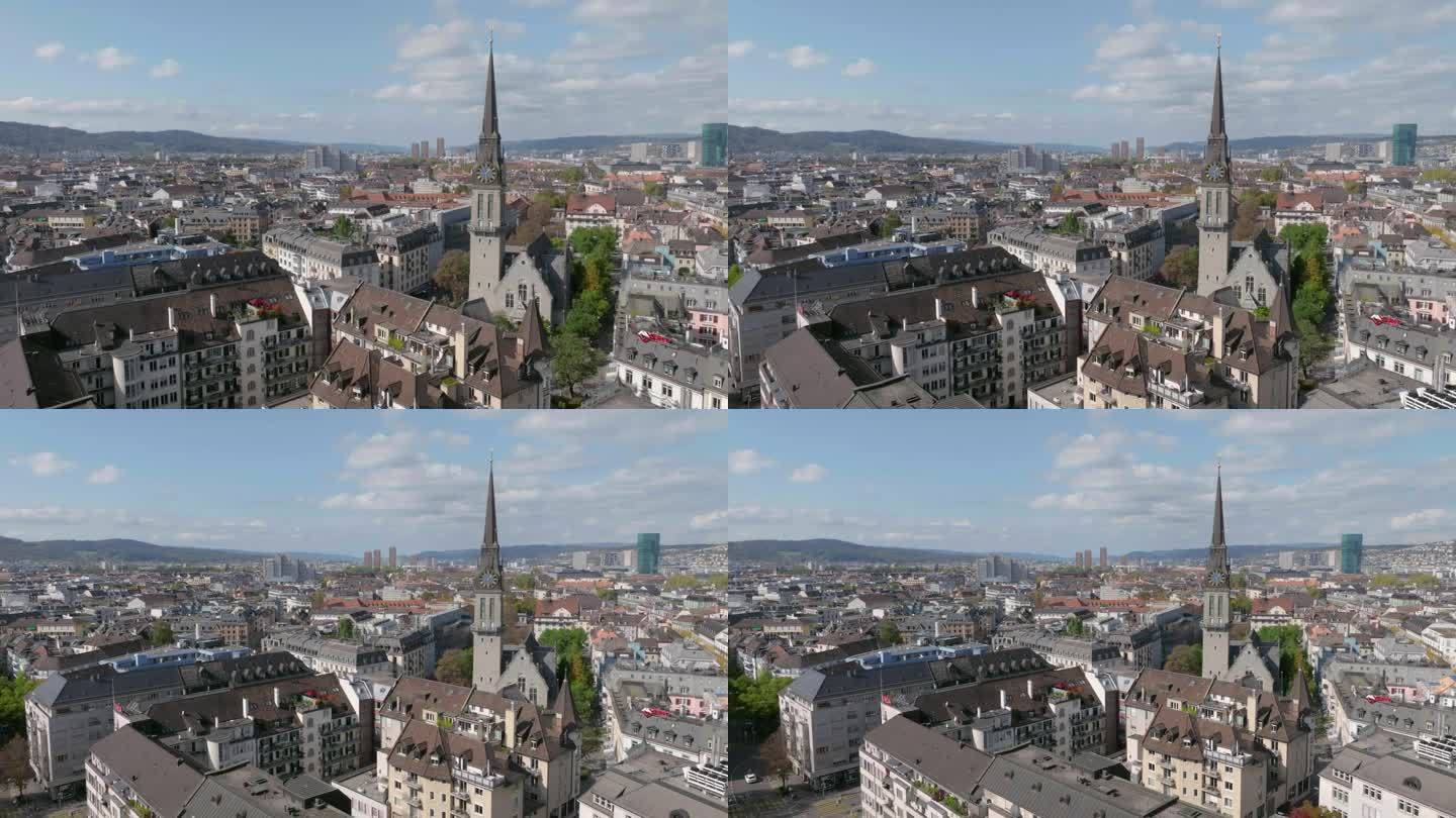 白天苏黎世城市景观著名的教堂钟楼前外部航拍全景4k瑞士