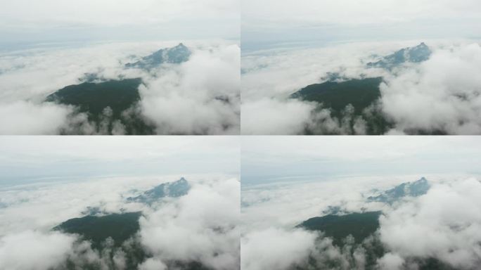 在雾流中飞越局部山脉。航拍视频