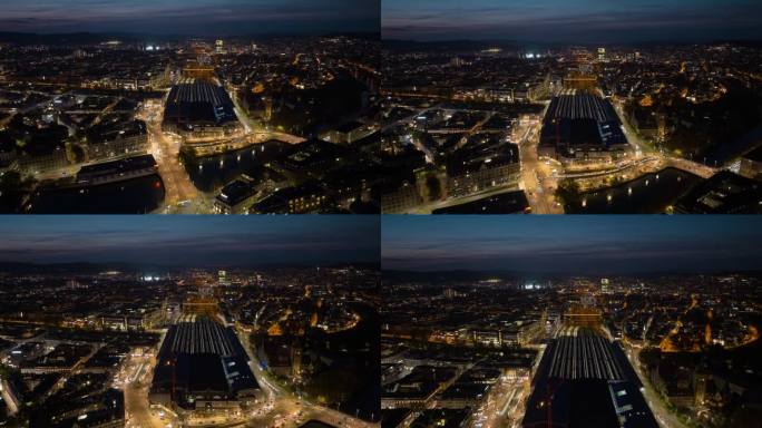 日落天空夜间照明飞行在苏黎世市中心主要火车站空中全景4k延时瑞士