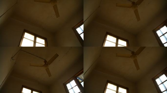 破旧房屋老旧房间挂着三角电风扇天花板风扇
