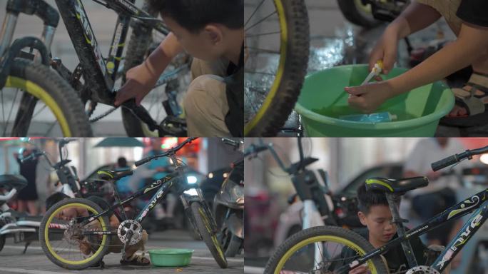童年记忆在路边洗自行车的小男孩