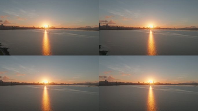 航拍早晨日出金色阳光照射在深圳湾海面