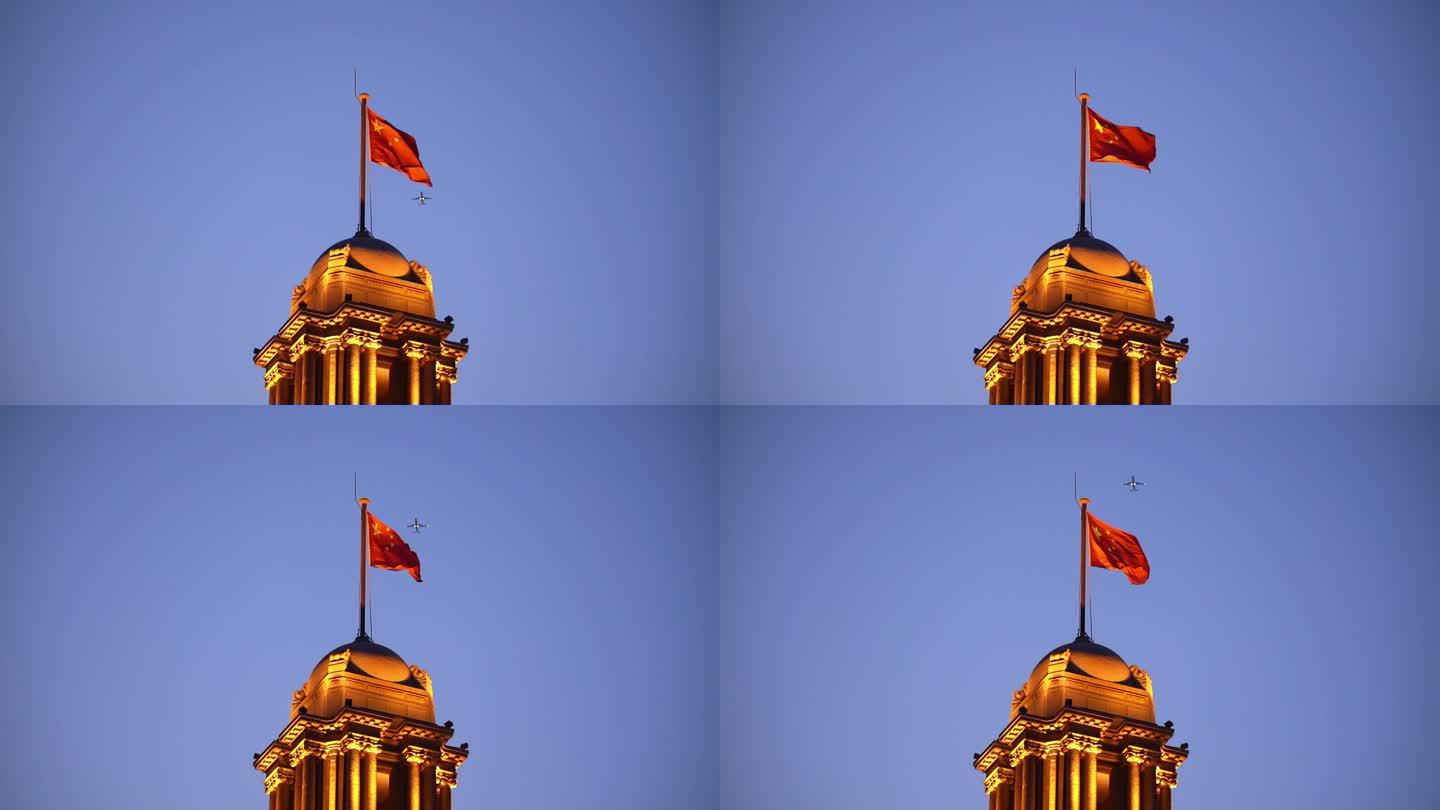 飞机穿越上海外滩建筑上的国旗