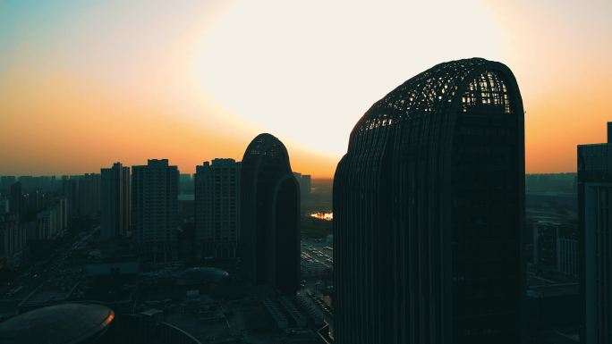 航拍4K夕阳点缀五彩世界高楼