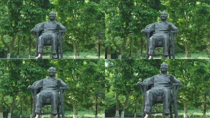 邓小平坐椅子雕像推近