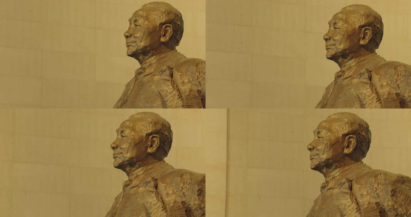 邓小平雕像头部特写从左往右