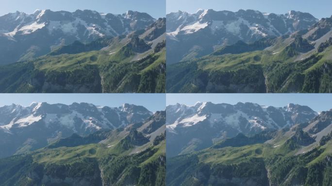 高空无人机拍摄的高山景观和身后的雪山