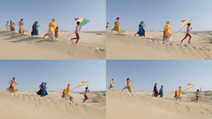 一群快乐的印度孩子带着五颜六色的风筝奔跑，印度