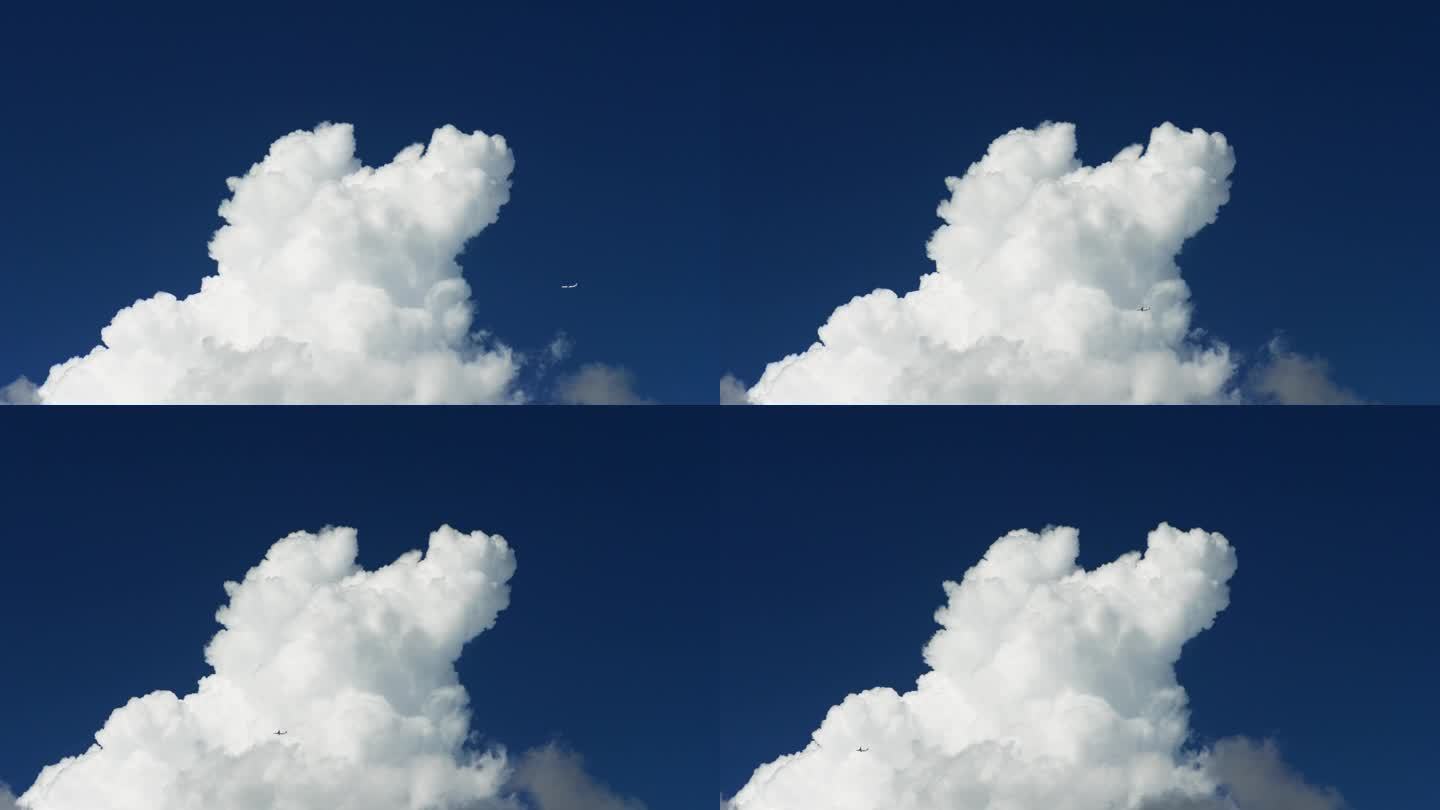 4k镜头的飞机飞越白云蓝天为背景，实时视频。