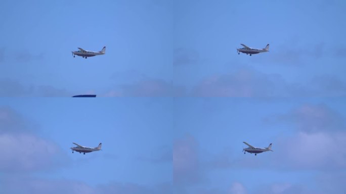 小型飞机在清澈的蓝天中滑翔，4k慢动作，60fps