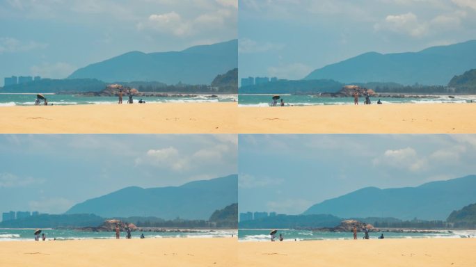 海南万宁石梅湾沙滩上的游客和热浪