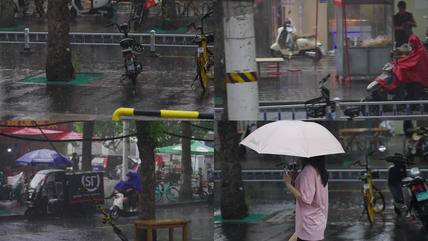 城市街道暴雨下雨打伞淋雨冒雨骑电动车穿行