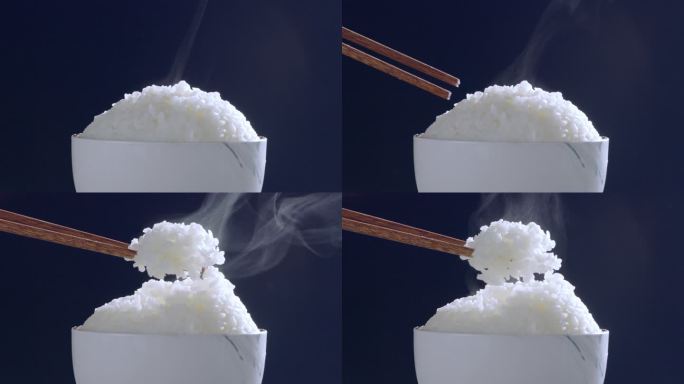 筷子夹起冒着热气的香喷喷的米饭五常大米