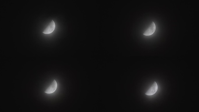 半月形近景，夜间黑色天空背景，云雾飘动，月光闪耀，长焦镜头4k延时镜头。
