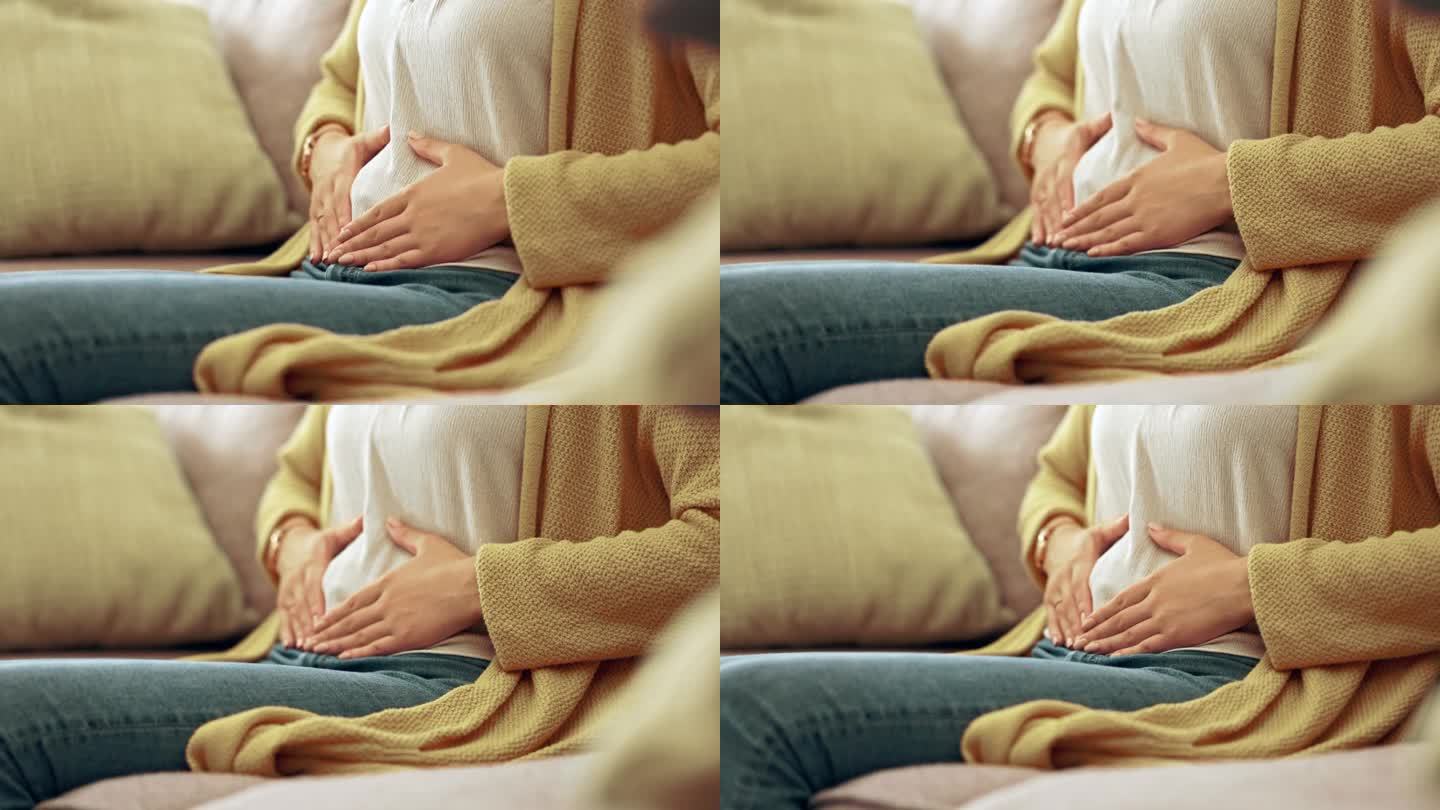 痛经、经期和女性用手捂胃用于月经周期、怀孕或腹部绞痛。健康，消化问题和女孩在沙发上抱着腹部子宫内膜异