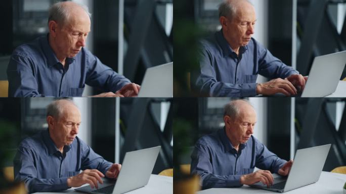 70岁老人在家里用笔记本电脑工作，老人在键盘上打字