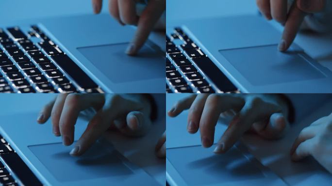 女性手使用笔记本电脑触摸板