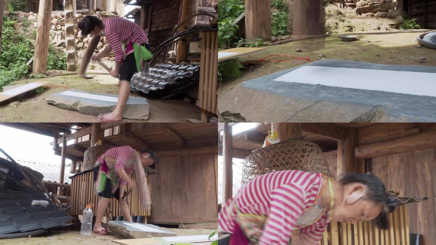 苗族妇女手工织布锤布工艺