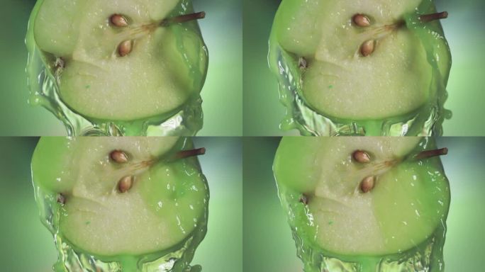 从半个苹果流出的青苹果汁，微距慢镜头