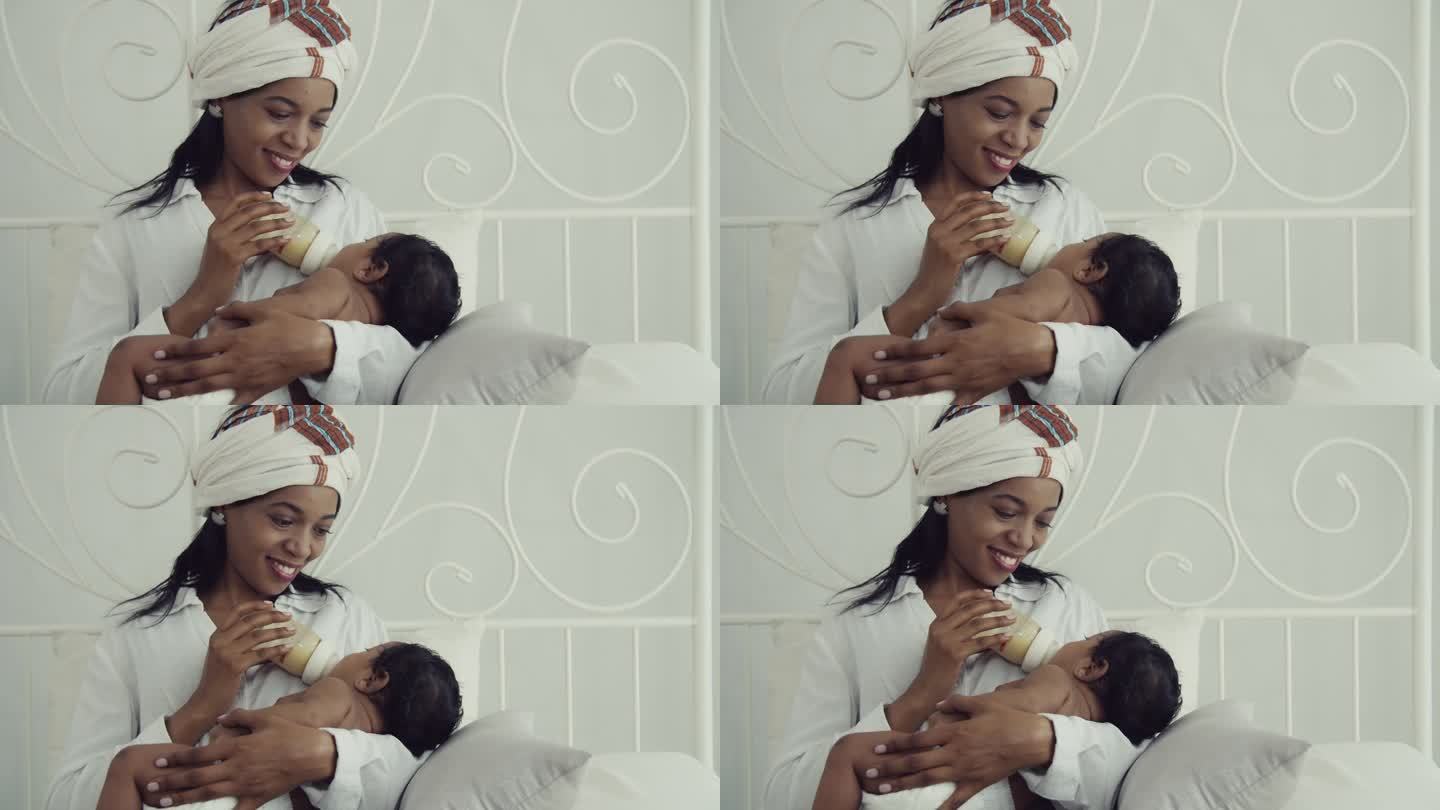 珍爱母亲:非裔美国母亲用奶瓶哺育婴儿|快乐的家庭纽带