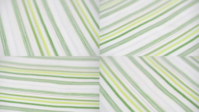 旋转纹理的白色棉料与细绿色条纹特写条纹棉织物宏观