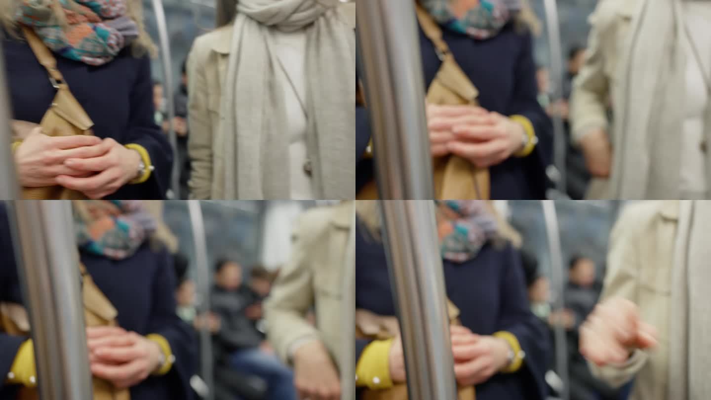女子握着地铁车厢的把手