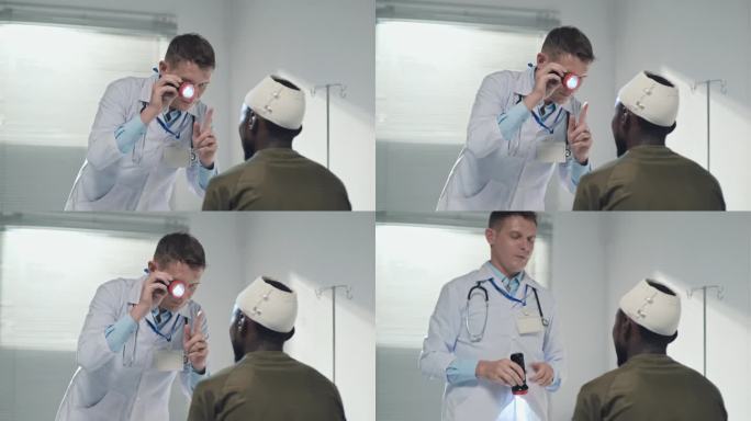 医生在医院用手电筒检查伤兵视力