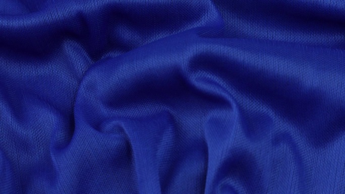蓝色织物背景。蓝色布料波浪背景纹理。蓝色织物是纺织材料。