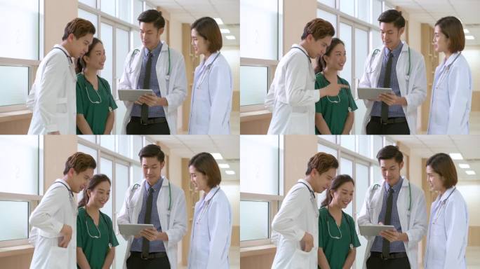 亚洲医生站在医院里微笑着谈论治疗病人。