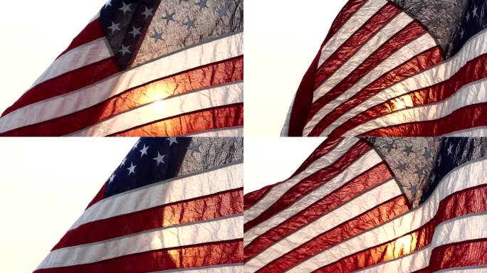 近距离挥舞着美国国旗在自然户外设置与太阳射线耀斑自然户外背景。七月四日，独立日，七月四日，阵亡将士纪