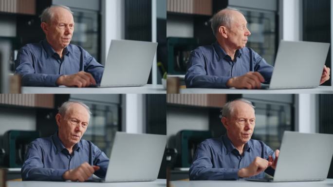 健康老人的画像，家里有笔记本电脑，祖父在看显示器