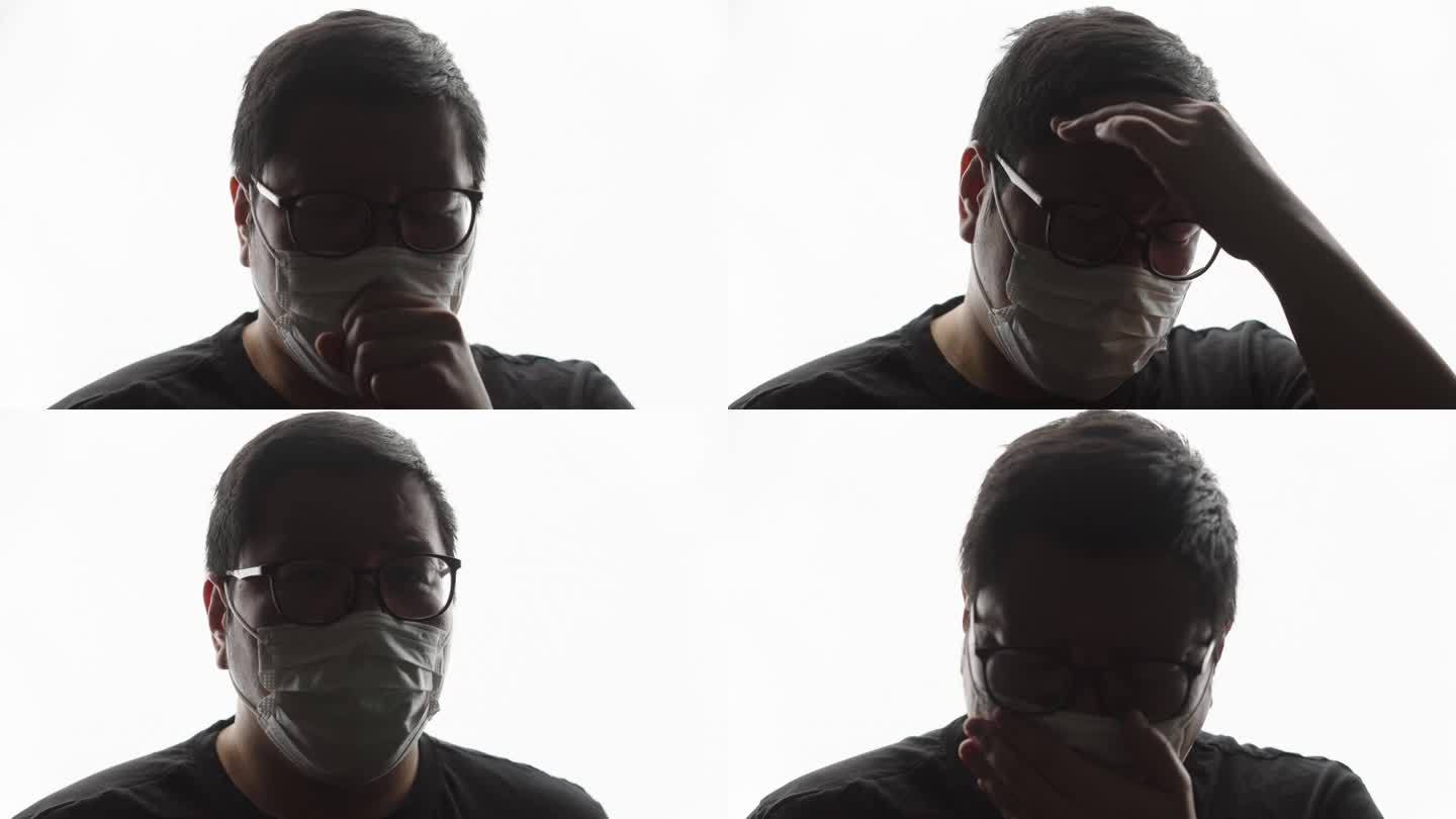 患病的大块头男子戴着口罩咳嗽的正面照片