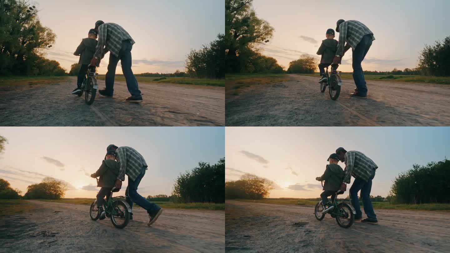 孙子和爷爷一起学在户外骑自行车。
