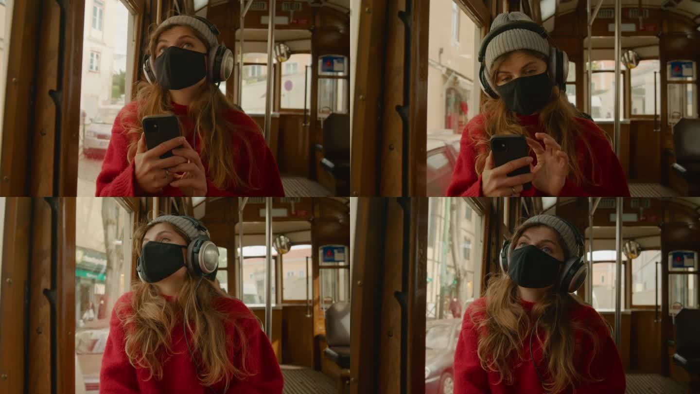Young woman in face mask ride in tram or bus