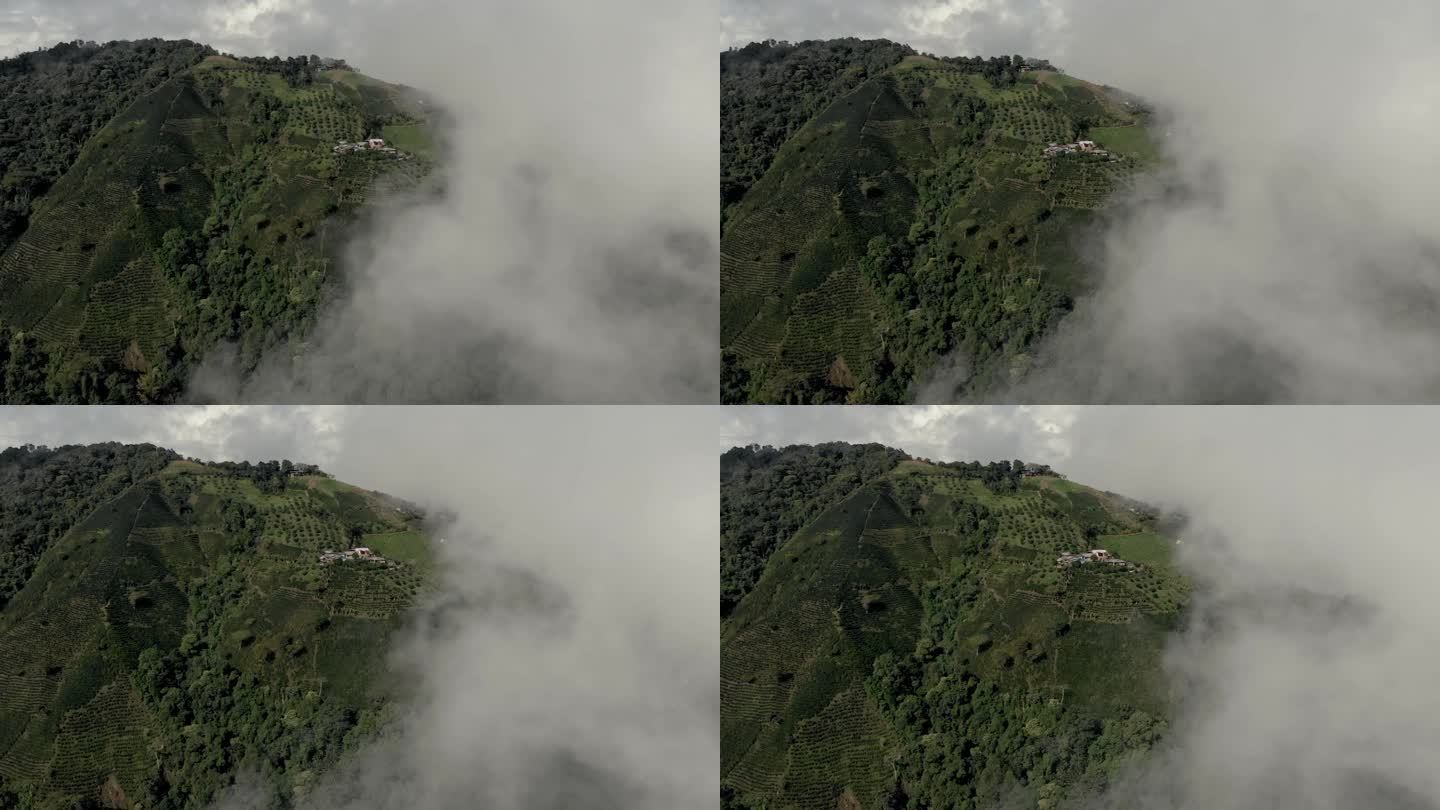 无人机在云中发现耕地山脉的航拍照片