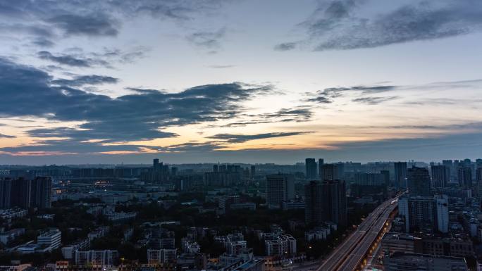 城市清晨城市天亮日出朝阳朝霞彩霞光延时