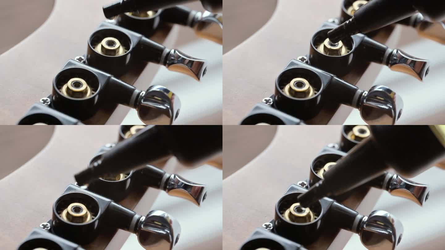 男子润滑电吉他调谐器上的吉他头。4k微距视频素材UHD 3840x2160