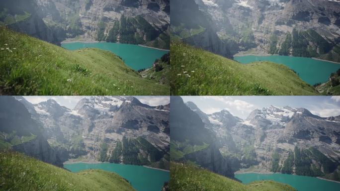 奥斯奇宁湖(Oeschinen Lake)高山湖泊，上面有悬崖和雪峰