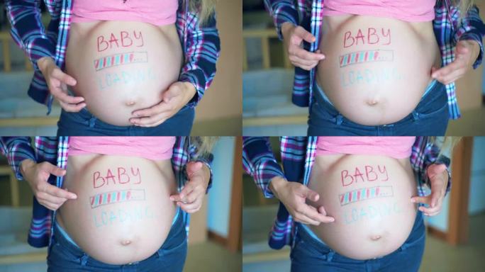 蓝色和粉红色的婴儿在怀孕的女人肚子上装载铭文，快乐的妈妈用手抚摸她赤裸的肚子，表达她对孩子的爱和感情