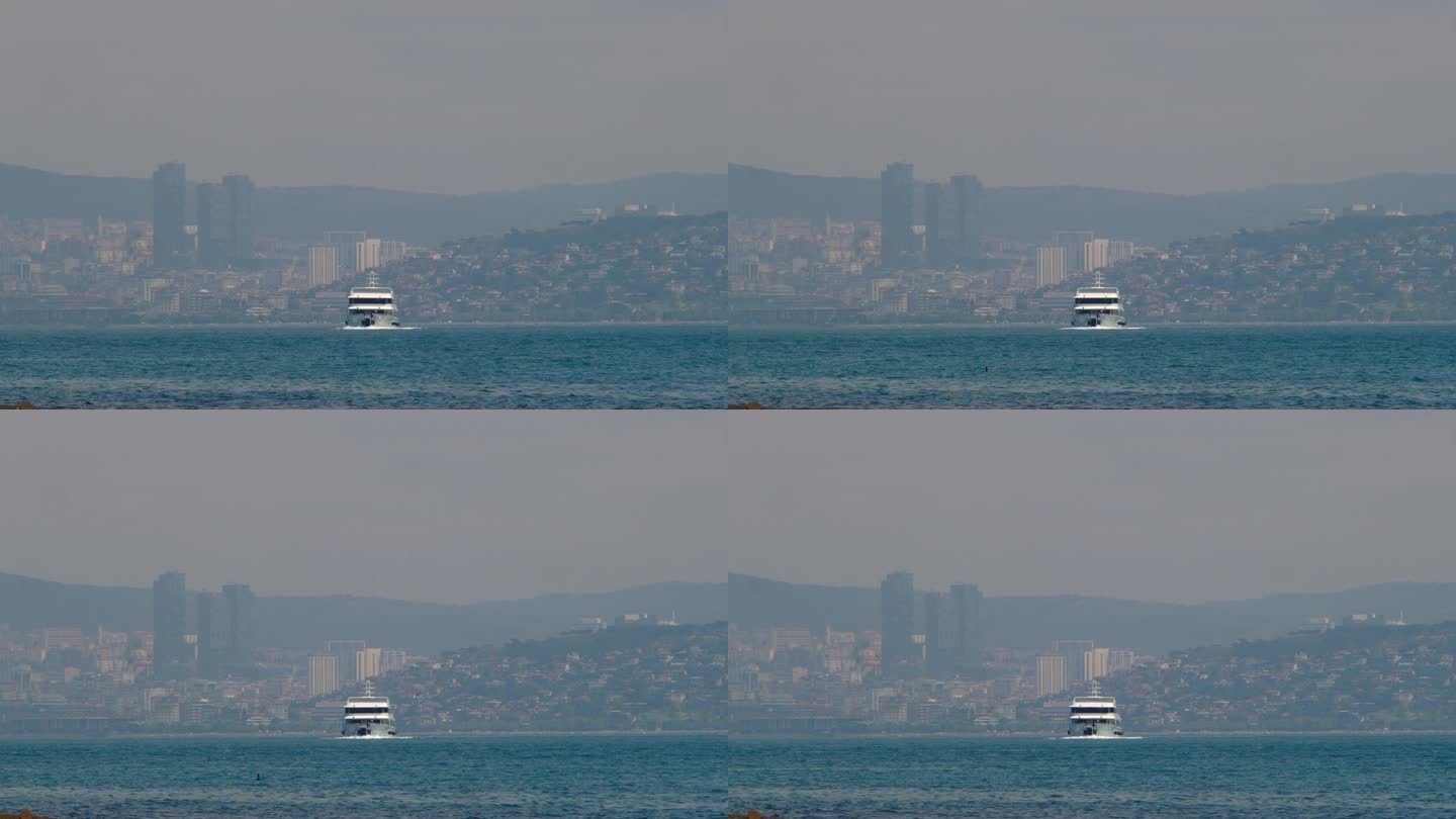 一艘客轮在这座现代化大都市的背景下驶向大海。一艘船在土耳其伊斯坦布尔的博斯普鲁斯海峡。都市风格。工作