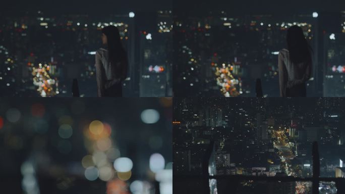 城市之夜年轻女性在欣赏夜景背影实拍